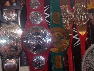 WWE  & UFC championship titles autographed photos and wrestling rings and action figures