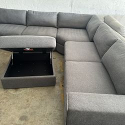 Thomasville Bryden Fabric Sectional with Storage Seats and Ottoman  Retails for over $1,800 It’s new  Features: Modern Style with a Clean Look Hidden 