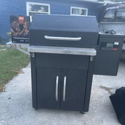 Traeger grill with owner's manual included.