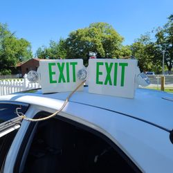 TWO EXIT SIGNS