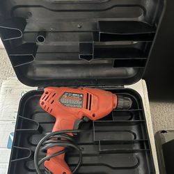Red electric drill in carrying case.