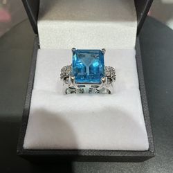 14k white gold blue stone ring with diamonds. 5.8 grams. Ring size 6