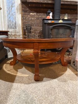 Round wooden and glass coffee table