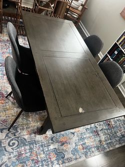 Set of four kitchen table chairs and a wooden table