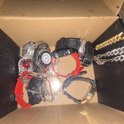 7 Watch’s , 2 Silver Cuban Bracelet , One Gold Cuban Bracelet , Cross Necklace , Lion Neck Necklace Not Real Diamond But It’s 1 Of 1 