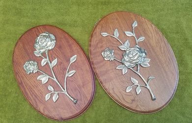 Oak wall plaques with metal roses.