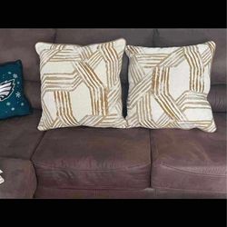 PILLOWS - 2 Brown/Tan Design on front Brown fake leather on other side $25 19082