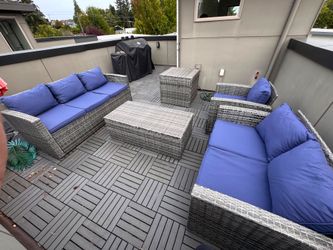 Outdoor Wicker Patio Furniture Set with Blue Cushions and orange parasol (umbrella)