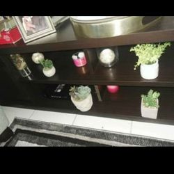 Tv console/ Tv stand. you can place it in front of your bed or in closet to sit down and storage.