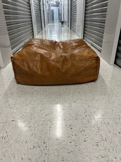 CB2 leather ottoman pouf.