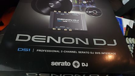 Denon DJ and two blue colored digital slbums