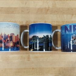 SET OF 3 NEW NEVER USED NY CITY COFFEE CUPS / MUGS OF NEW YORK CITY MANHATTAN'S SKYLINE & WATERFRONT SCENERY VERY COLLECTIBLE 