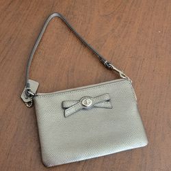 Coach Turnlock Small Wristlet with Bow  Silver Gray Leather Wallet. 
Pre-owned, perfect shape. Zip closure. 6.25x4.25".  