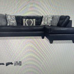 Barely Used Leather Sofa with Chaise And Pull Out Bed