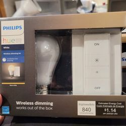 Philips Hue White Wireless Dimming Kit, which includes a smart LED bulb and a wireless dimmer switch