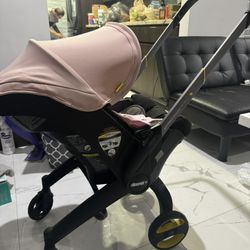 Doona Stroller/car seat, Pink, With The Base