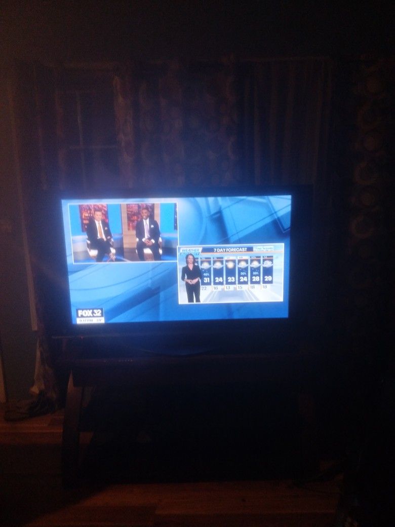 A. BIG. COLOR. TV. P L U S. COMES. T V S T AND