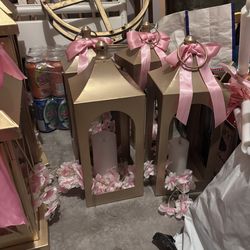 Pink small lanterns and candlesticks