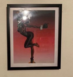 Old school Harley Quinn art piece in black frame