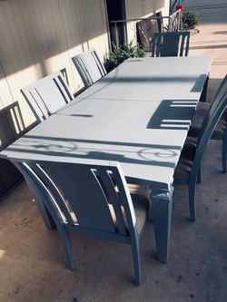 Kitchen dining table with extra leaf and six chairs