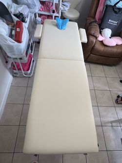 Professional facial bed with chair included for the same price.