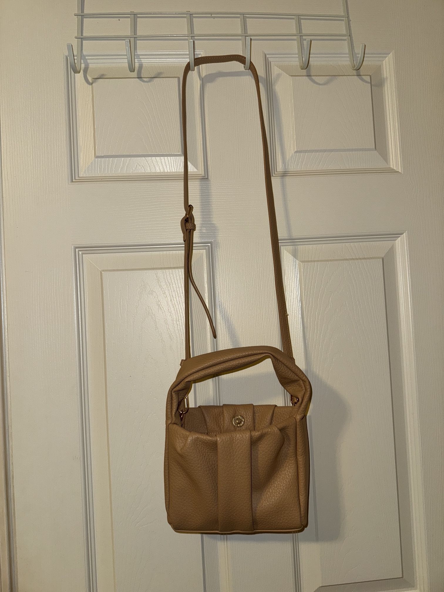 Tan and brown leather crossbody Purse bag with adjustable strap and zipper closure 