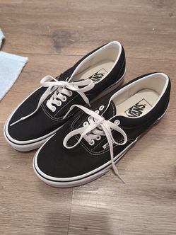 Vans Era classic low-top sneakers in black and white.