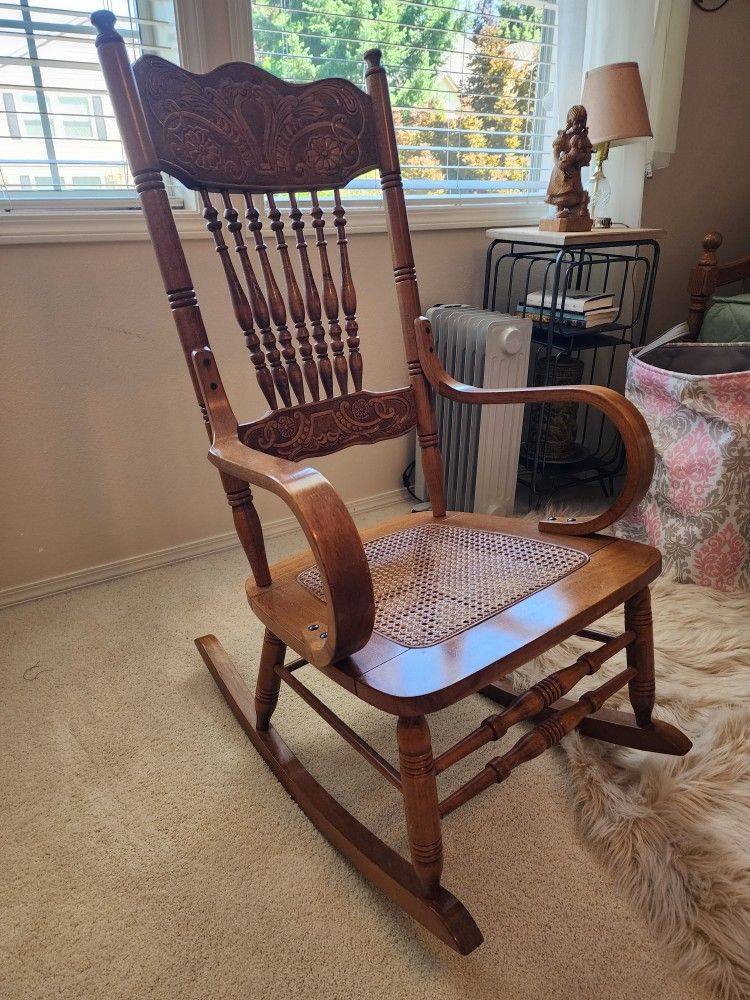Solid Wood Rocking Chair with Rattan seat. Perfect for new mom's