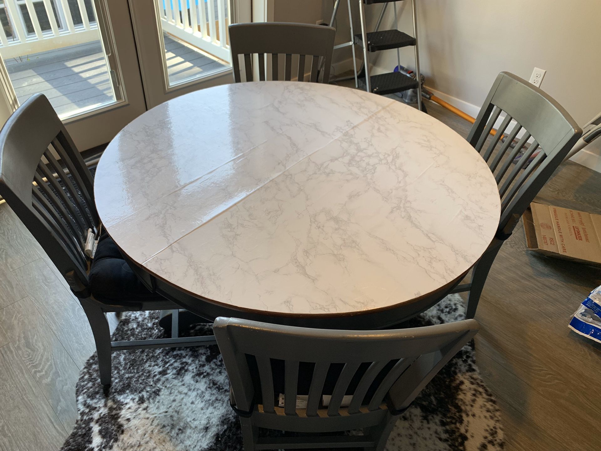 Repurposed round wooden table and chairs