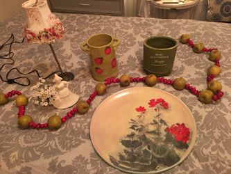 Beautiful 14 inch round serving platter, a plant holder purchased and I love Paris in Oakdale and never used, a hand-painted utensil holder for the k