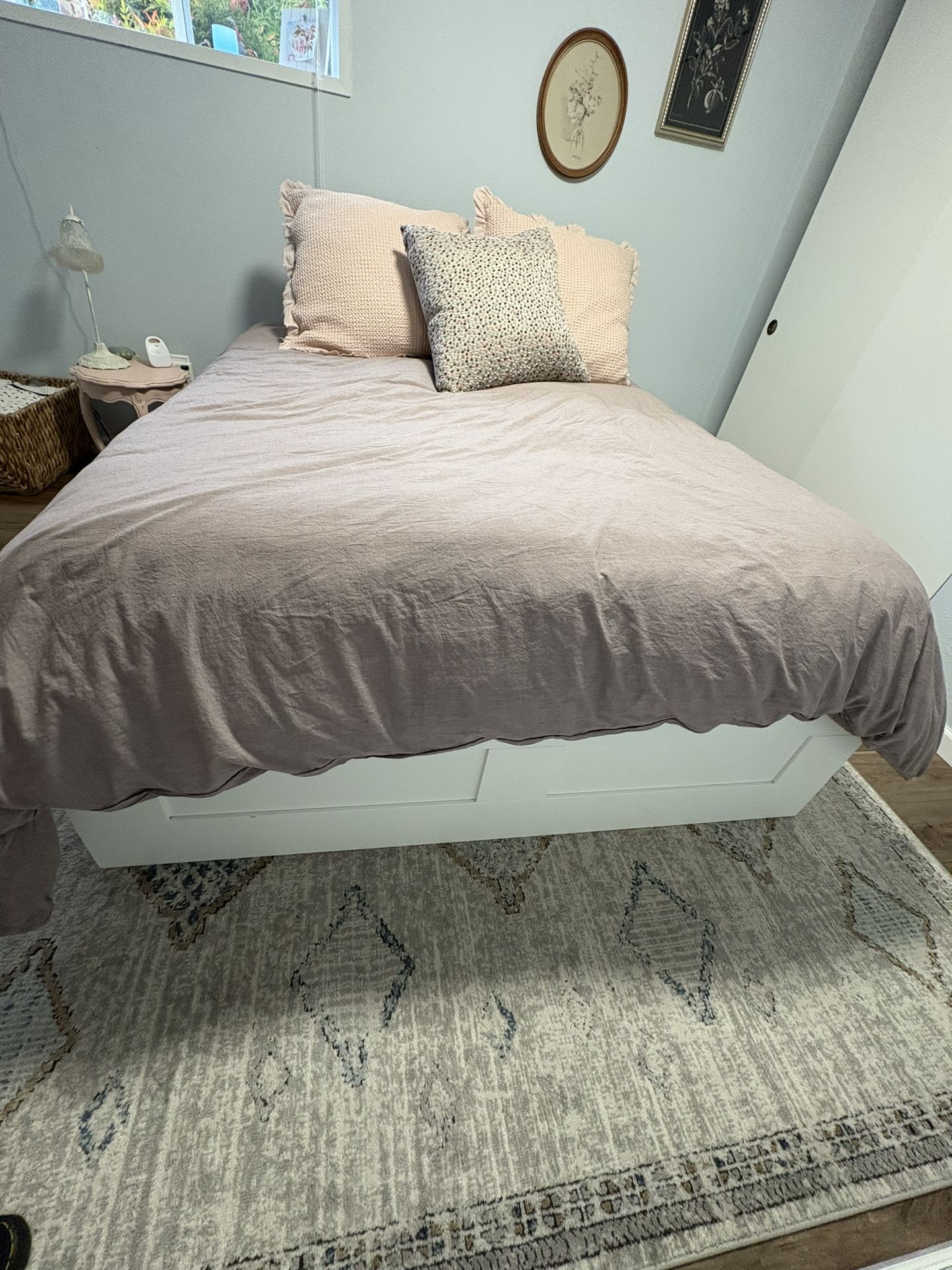 White Queen IKEA bed frame with storage