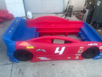 Two Kids race car beds with mattresses