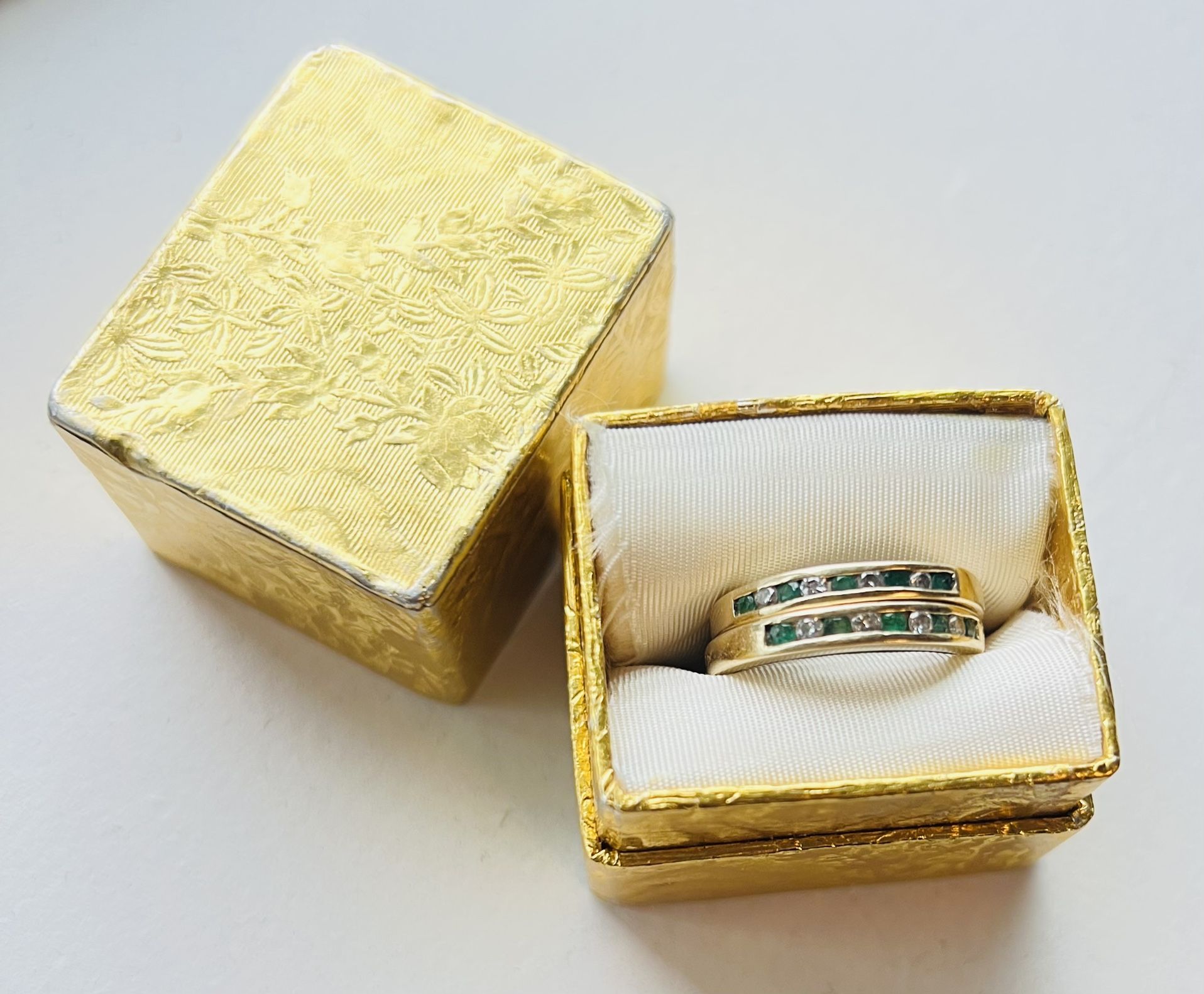Two 10 karat solid gold emerald & diamond rings