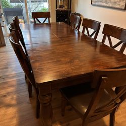 Solid Wood Dining Table w/ Built-In Leaf + 8 Chairs – $500