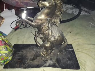 Bronze statue man rearing horse