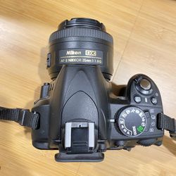 Nikon D3100 DSLR Bundle – 18–55mm Kit Lens + 35mm f/1.8 Prime