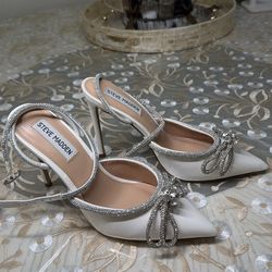 Steve Madden  size 7 white and silver ( only wore t for my wedding photos for two hours )
