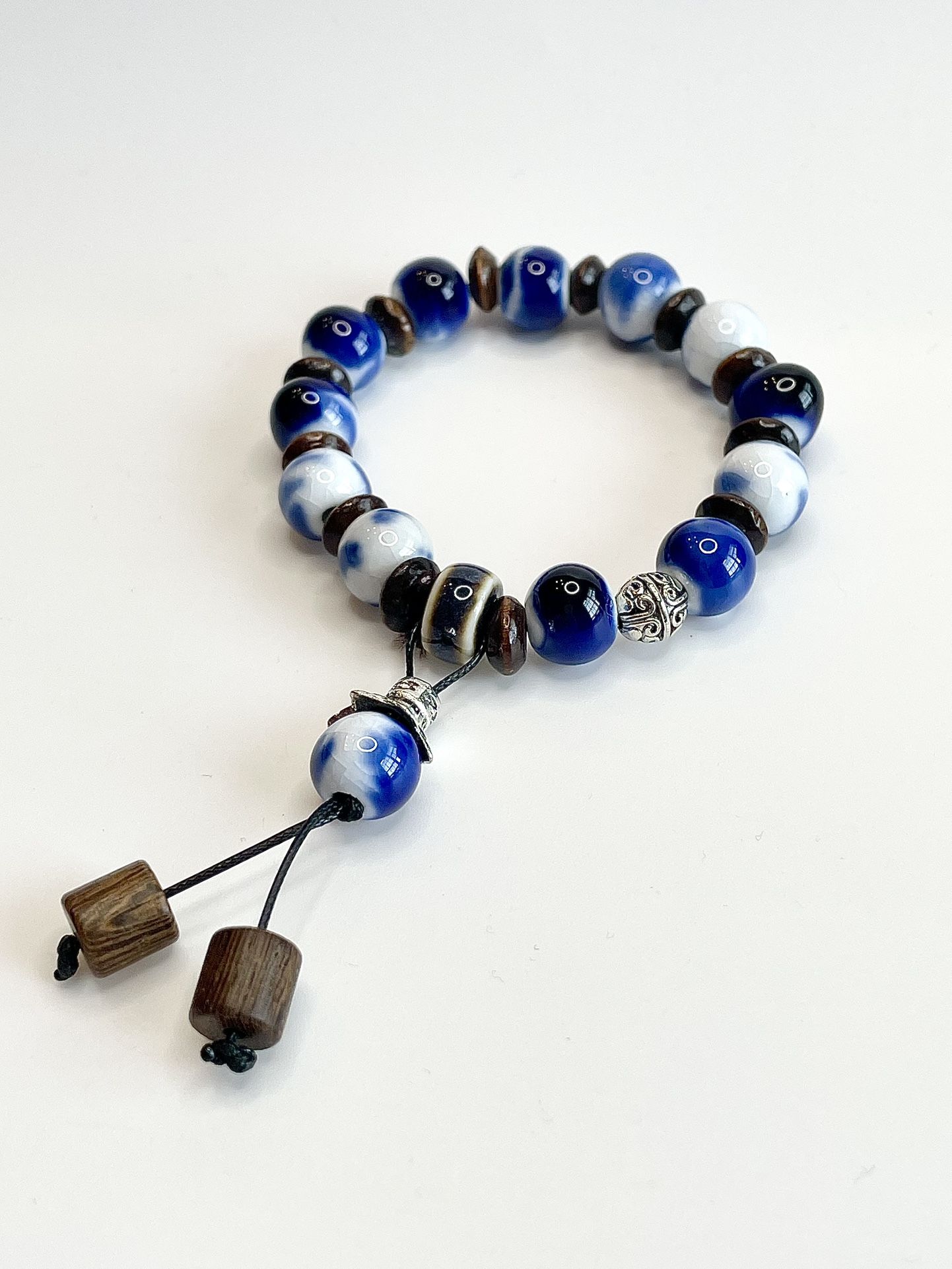 Blue & White Swirl Bracelet beaded tassel  stretchy brown wood charm