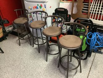 Set of 4 bronze metal swivel bar stools with comfortable cushioned seat upholstered in a beige fabric, mint condition , hardly used