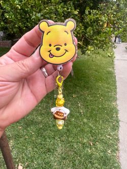 Wp badge reel with charm