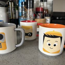 Seven Pixar Mugs
