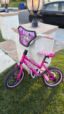 Minnie Mouse toddler bicycle with training wheels like new