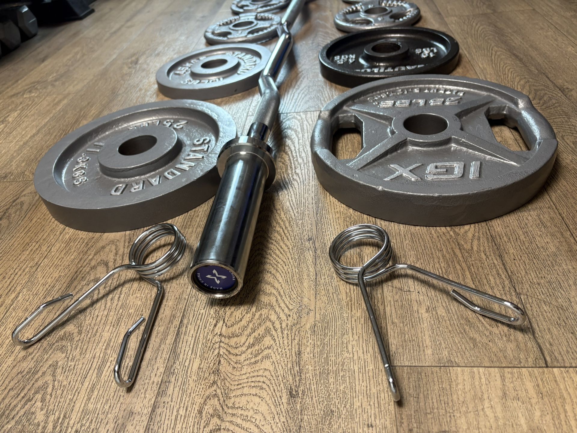NEW Olympic Curl Bar With Pairs From 5s To 25s [total: 105 lbs)