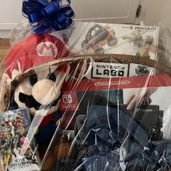 Black Nintendo Switch, Super Smash Bros Ultimate And Mario Plushie 