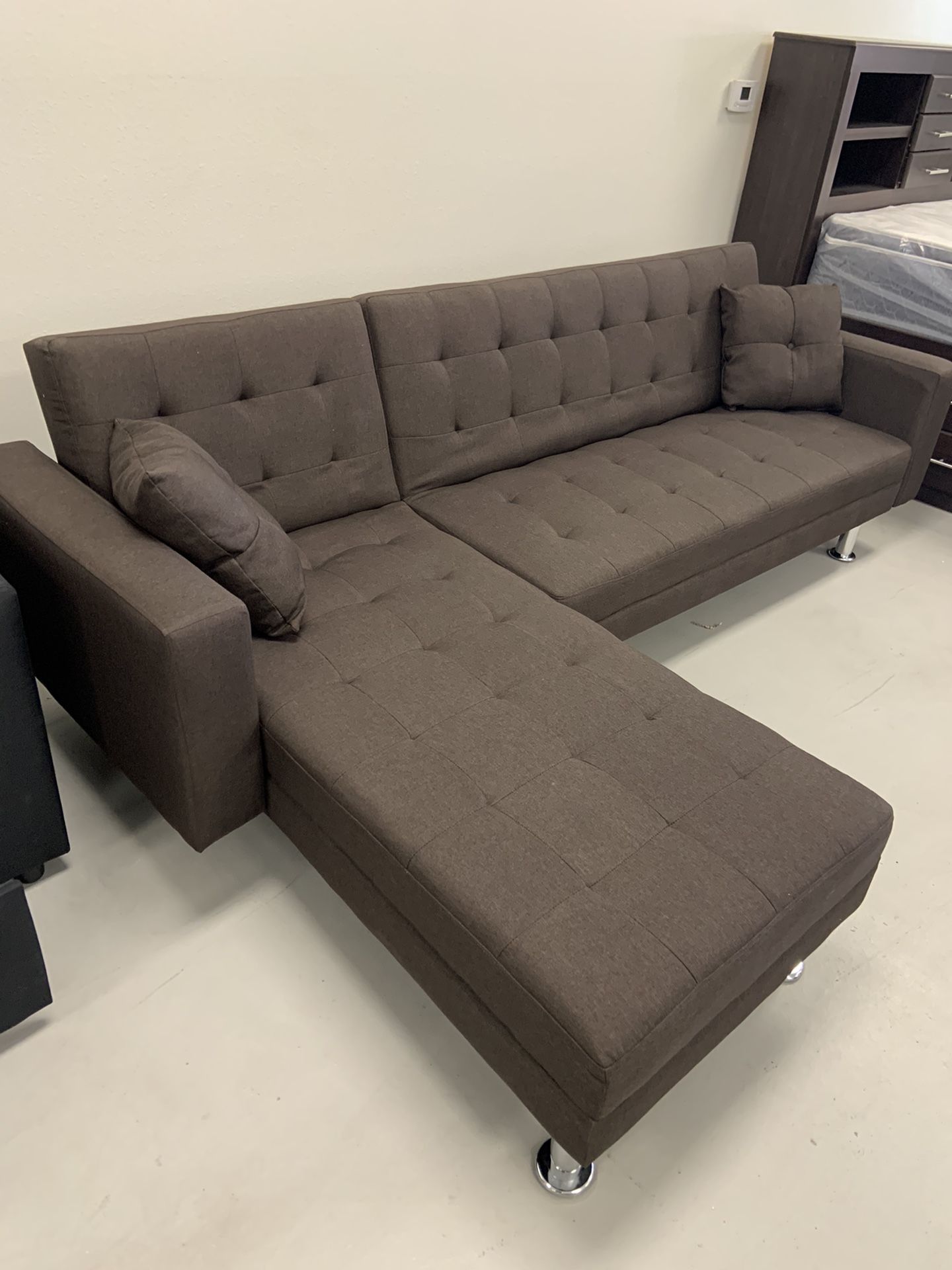 Brand New chocolate sectional,  reversible sleeper