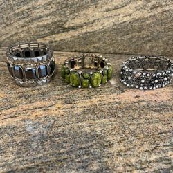3 Costume Jewelry Bracelets. Great designs. Olive color one missing one stone (shown in picture)