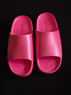 Pink Nike slides