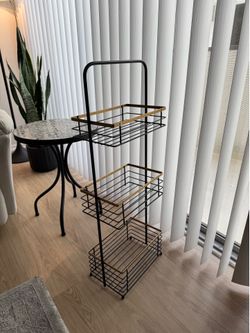 black and gold storage stand