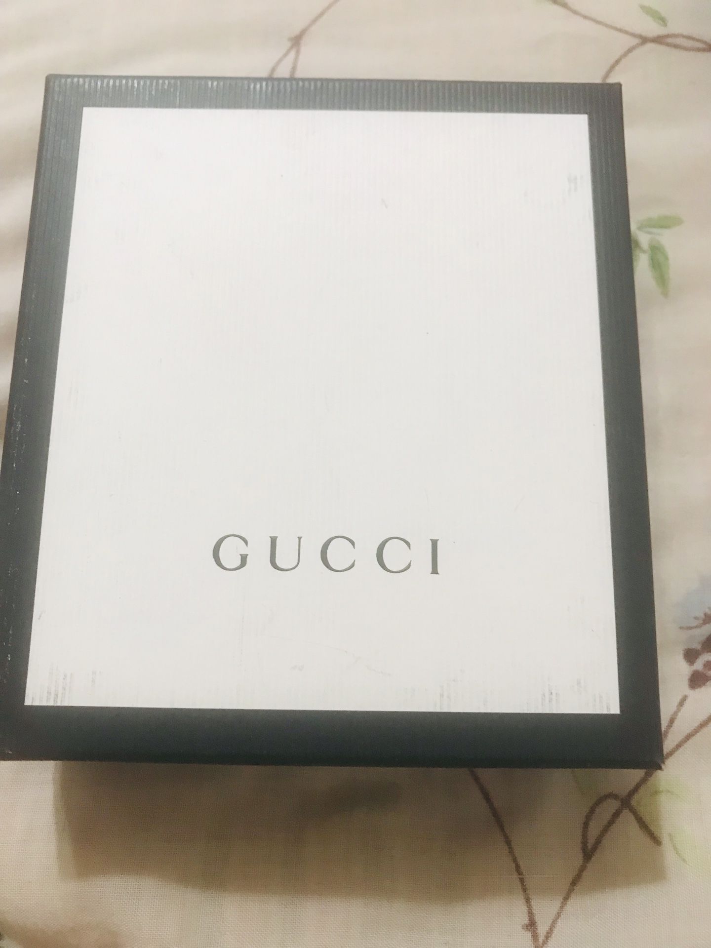 Gucci wallet and Tom Ford sun glasses