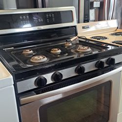 Black and stainless stoves.